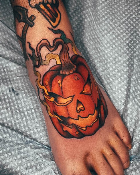 Decorative Pumpkin Tattoo On Female