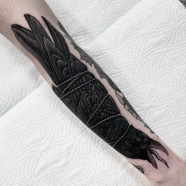 Decorative Raven Tattoo On Female Forearm