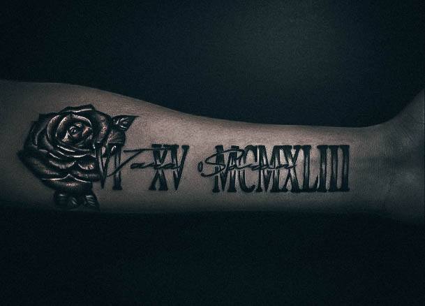 Decorative Roman Numeral Tattoo On Female