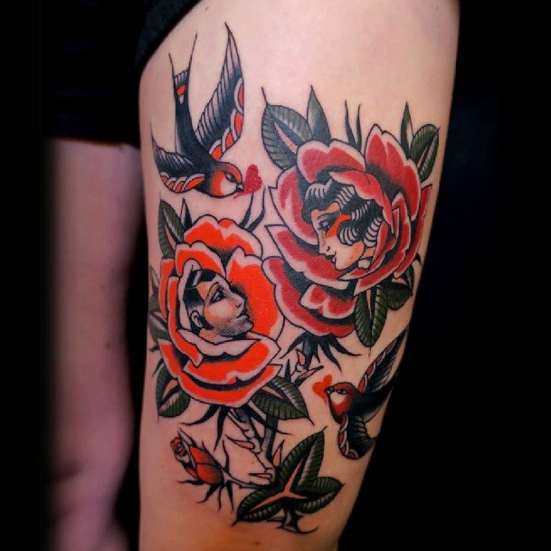 Decorative Rose Thigh Tattoo On Female