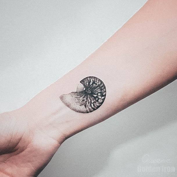 Decorative Seashell Tattoo On Female