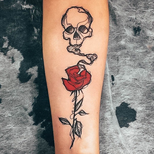 Decorative Skull And Rose Tattoo On Female