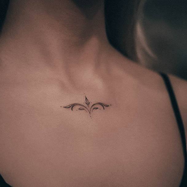 Decorative Small Chest Tattoo On Female