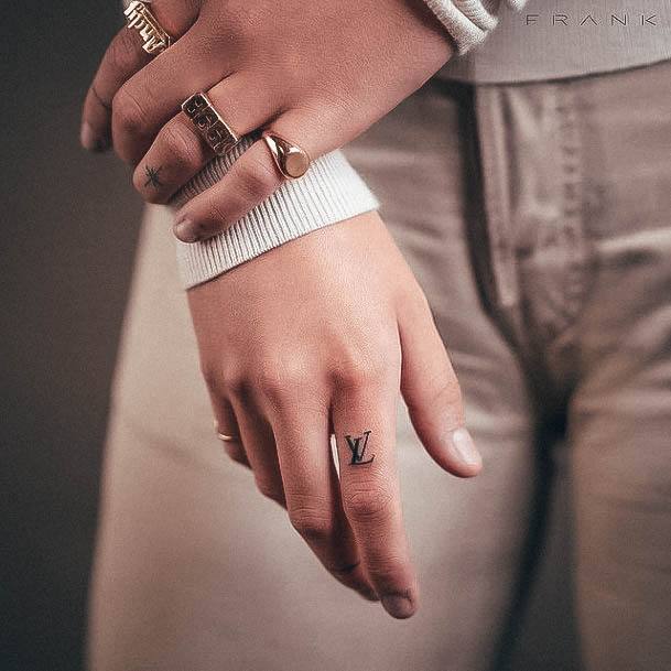 Decorative Small Hand Tattoo On Female