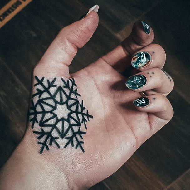 Decorative Snowflake Tattoo On Female