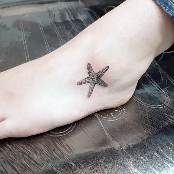 Decorative Starfish Tattoo On Female
