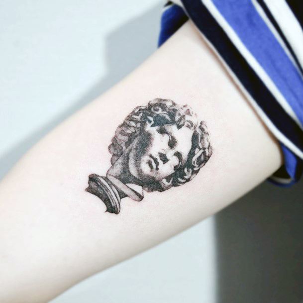 Decorative Statue Tattoo On Female