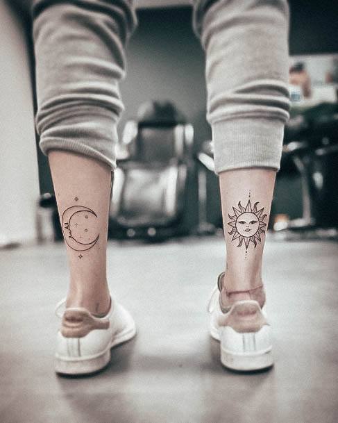 Decorative Sun And Moon Tattoo On Female