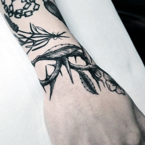 Decorative Thorns Tattoo On Female