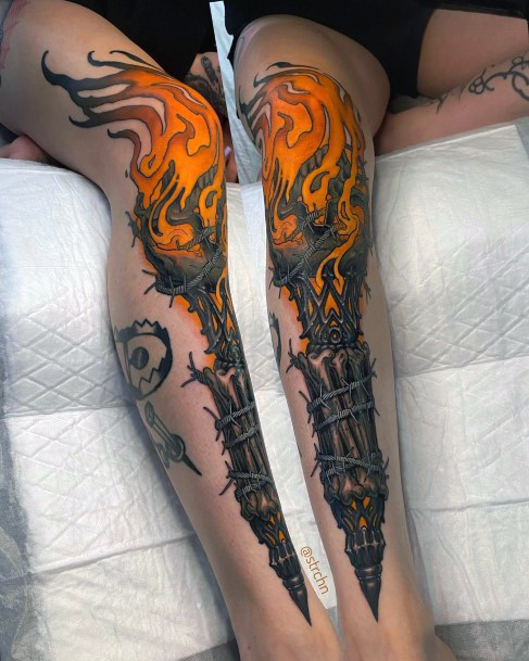 Decorative Torch Tattoo On Female