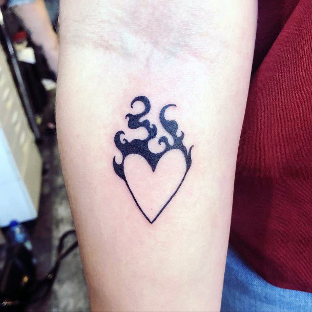 Delightful Tattoo For Women Flaming Heart Designs