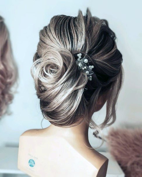 Demonstration Of A Loose Bridal French Twist For Women