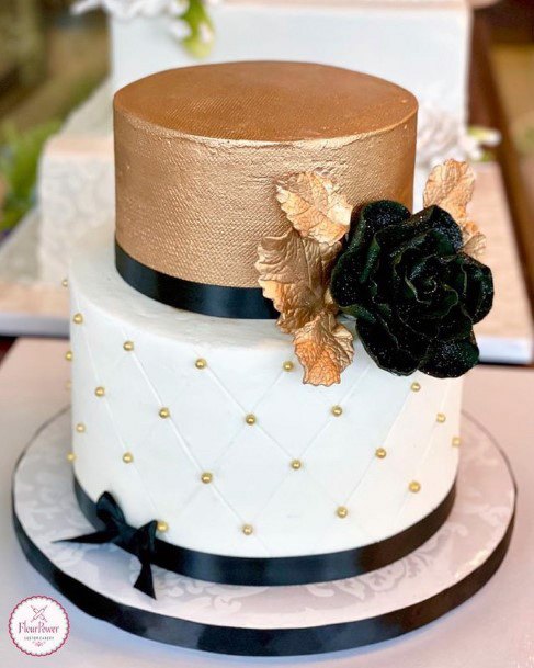 Designer Gold And White Wedding Cake With Black Rose