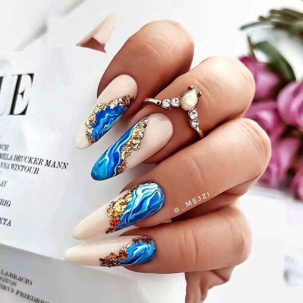 Distinctive Female Blue And Gold Nail Designs