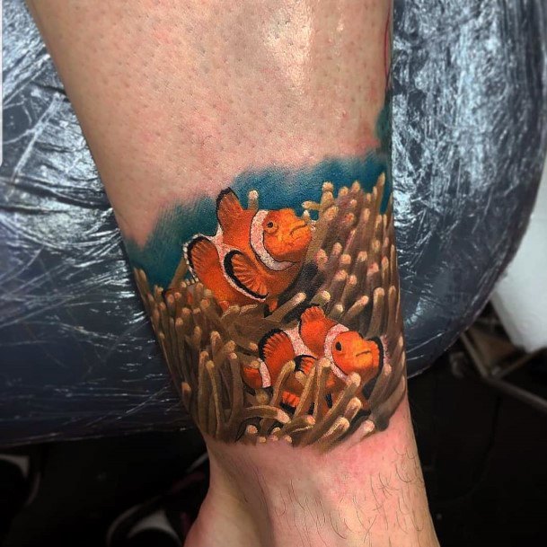 Distinctive Female Clown Fish Tattoo Designs