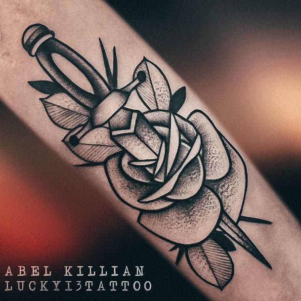 Distinctive Female Dagger Tattoo Designs