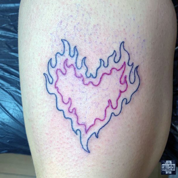 Distinctive Female Flaming Heart Tattoo Designs