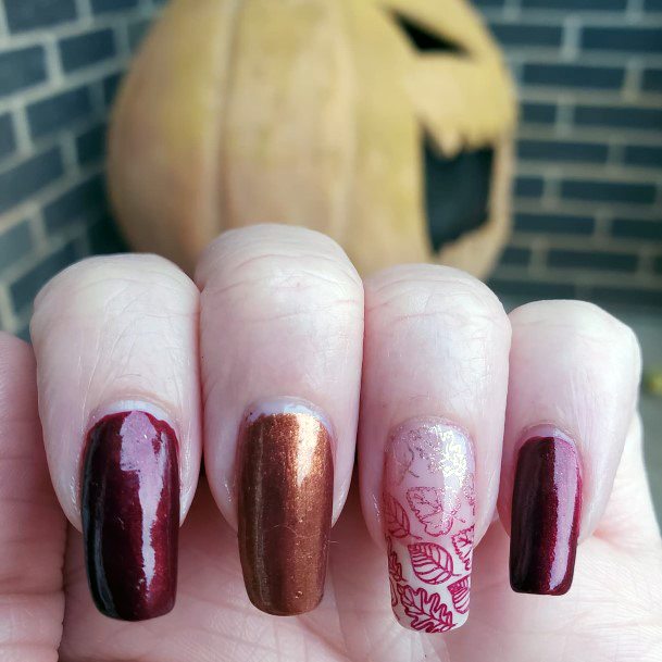 Distinctive Female Maroon And Pink Nail Designs