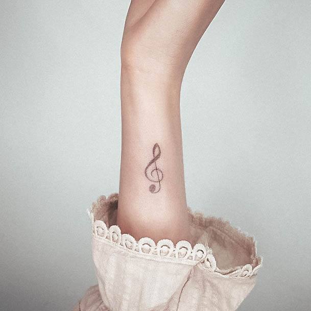 Distinctive Female Music Note Tattoo Designs