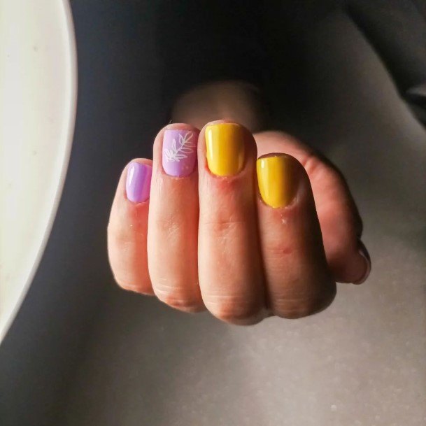 Distinctive Female Purple And Yellow Nail Designs