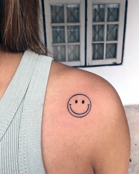 Distinctive Female Smiley Face Tattoo Designs