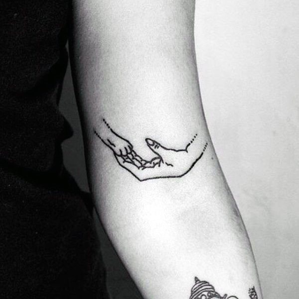 Dog Holding Hand Tattoo Womens Arms