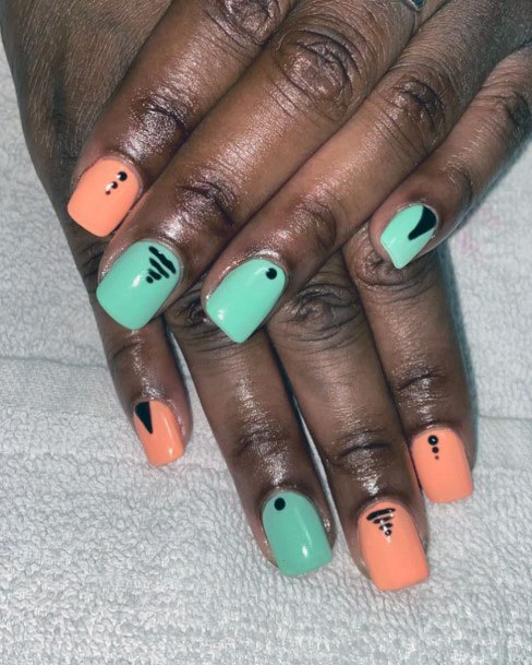 Dots And Scribbles Light Orange And Pistachio Colored Nails