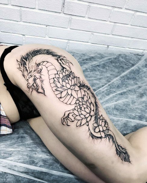 Dragons With Petalled Skin Tattoo Womens Legs