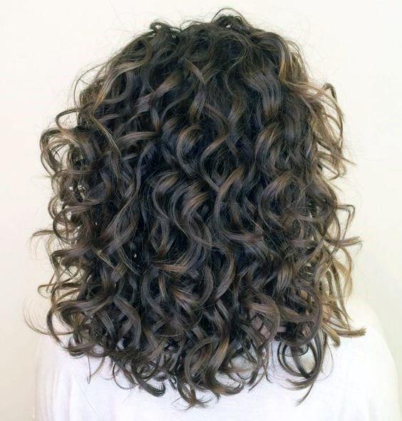 Dramatic Dark And Light Brown Textured Bouncy Curls Women’s Hairstyle