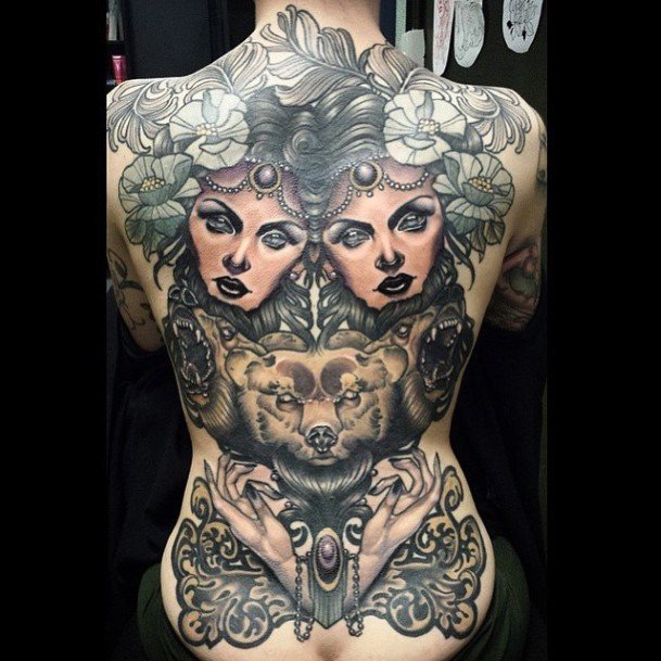 Dual Human Faces And Beast Tattoo With Flowers Womens Back