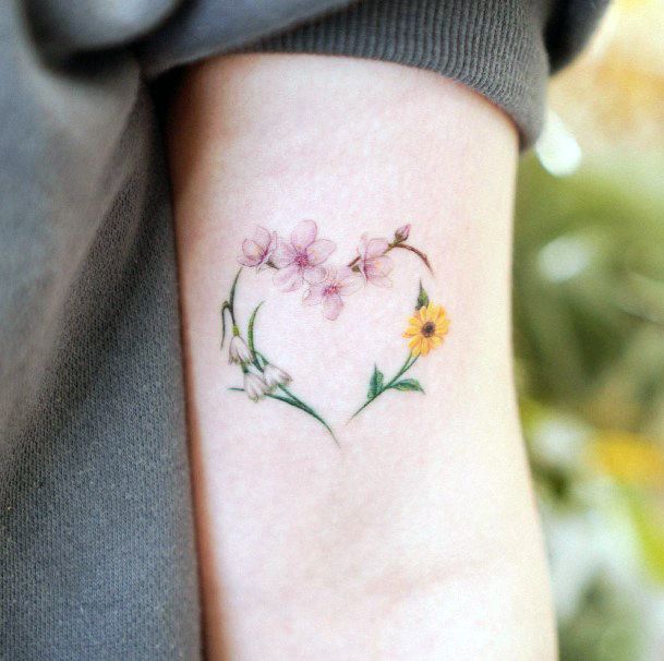 Elaborate Styles For Womens Flower Heart Tattoo