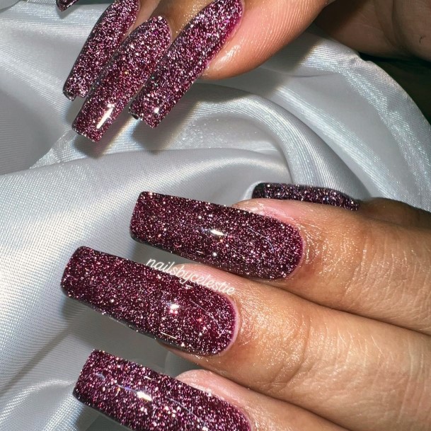 Elaborate Styles For Womens Maroon Glitter Nail