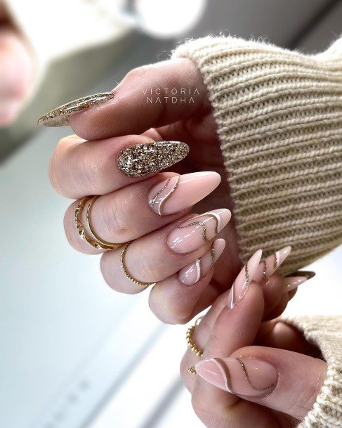 Elaborate Styles For Womens Metallic Gold Nail