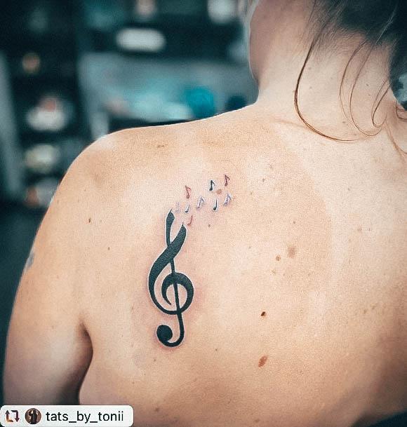Elaborate Styles For Womens Music Note Tattoo