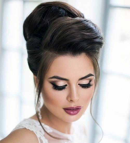 Elegant Beehive Hairstyles For Brunette Females With High Folded Bangs