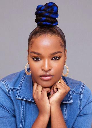 Elegant Black Woman Stylized With Black Blue Top Knot Hairstyle