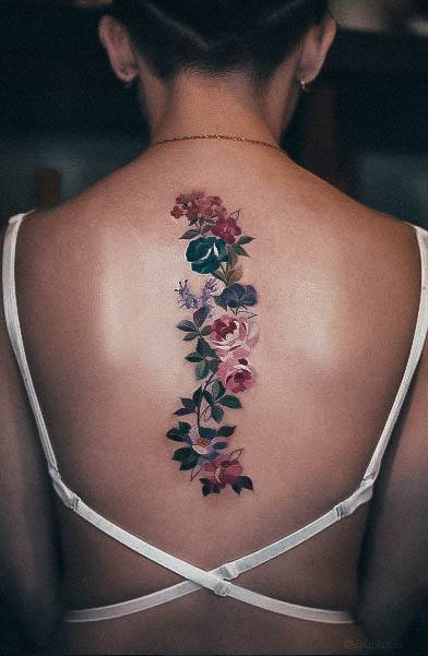 Enchanting Girly Tattoo Ideas For Women Spine Flowers