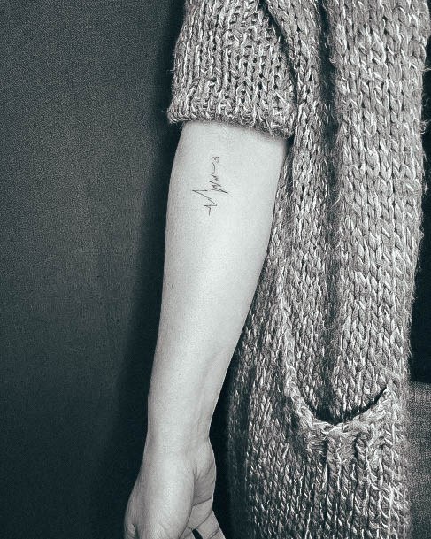 Enchanting Heartbeat Tattoo Ideas For Women