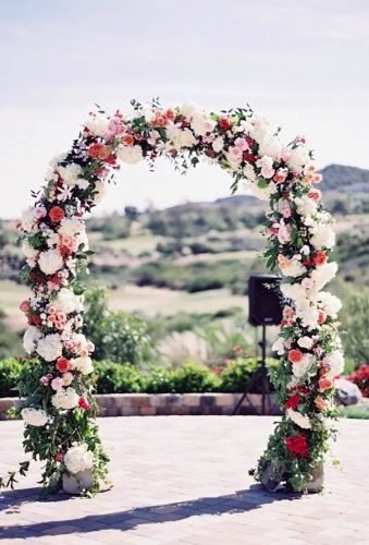 Enchanting Red And White June Wedding Flower Arch