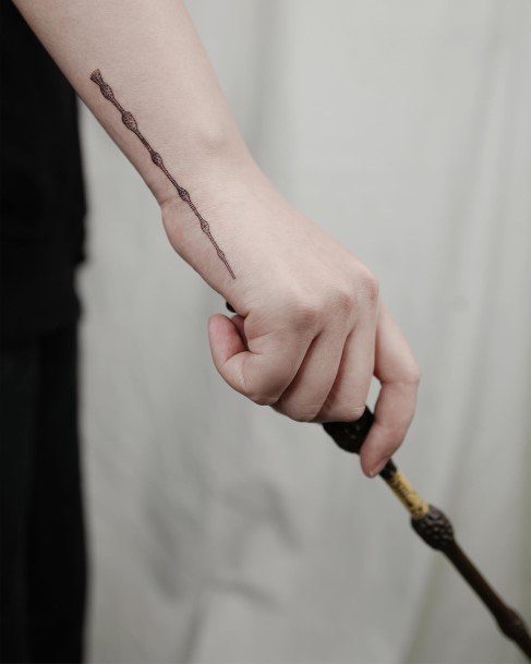 Enchanting Wand Tattoo Ideas For Women