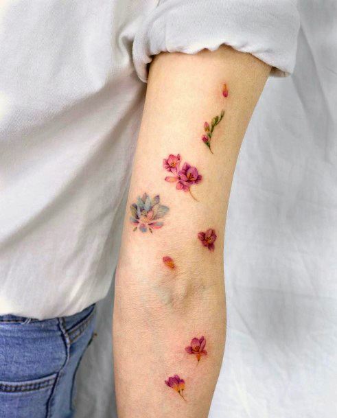 Excellent Girls Flower Petal Tattoo Design Ideas