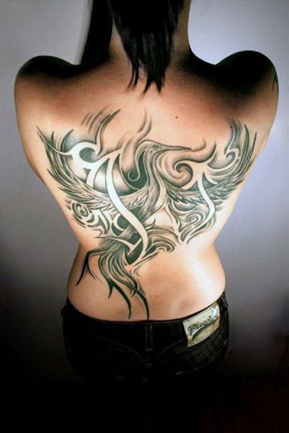 Expressive Tribal Tattoo Womens Back