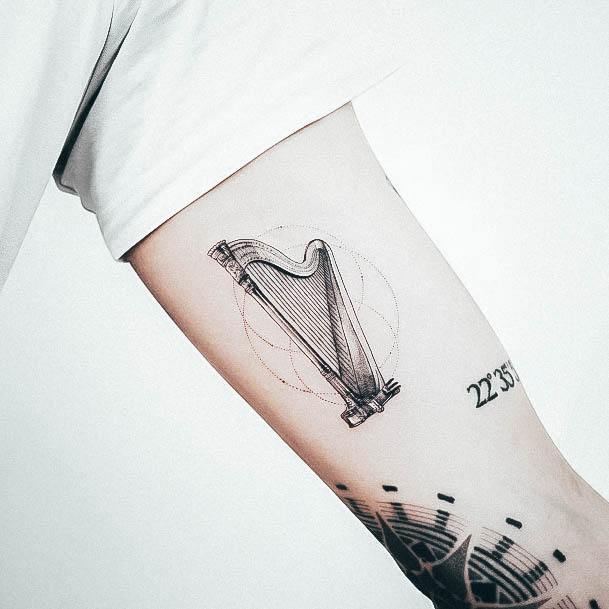 Exquisite Harp Tattoos On Girl