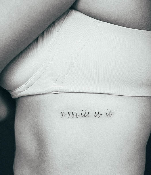 Exquisite Roman Numeral Tattoos On Girl Ribcage