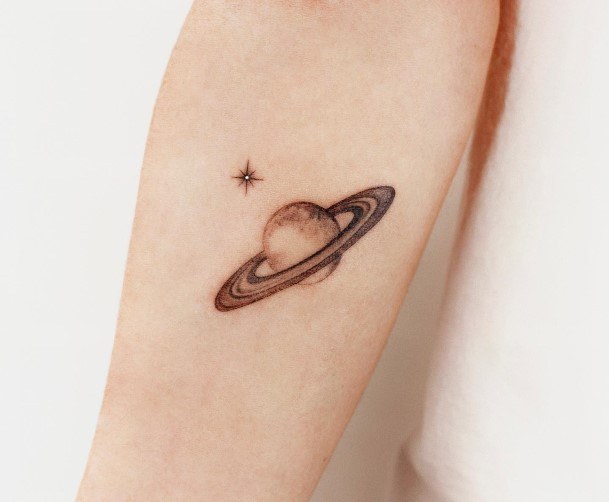 Exquisite Saturn Tattoos On Girl