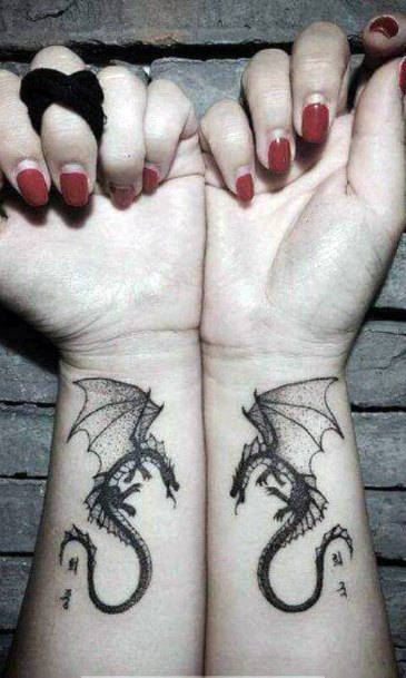 Fabulous Pair Of Dragon Tattoo Women Arms