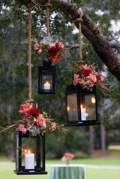 Fall Wedding Ideas Hanging Lanterns With Red And Range Flowers Backdrop Fall Wedding Ideas