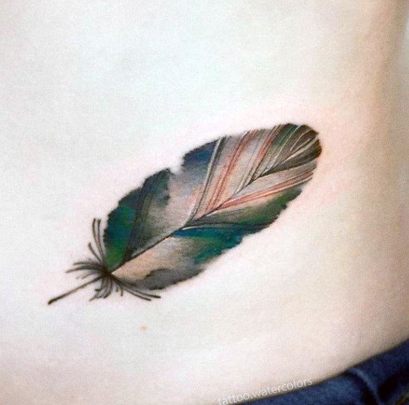 Feather With Green Tinges Tattoo For Women