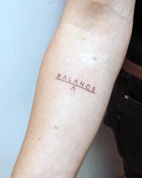 Female Balance Tattoo On Woman