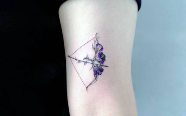 Female Bow And Arrow Tattoo On Woman